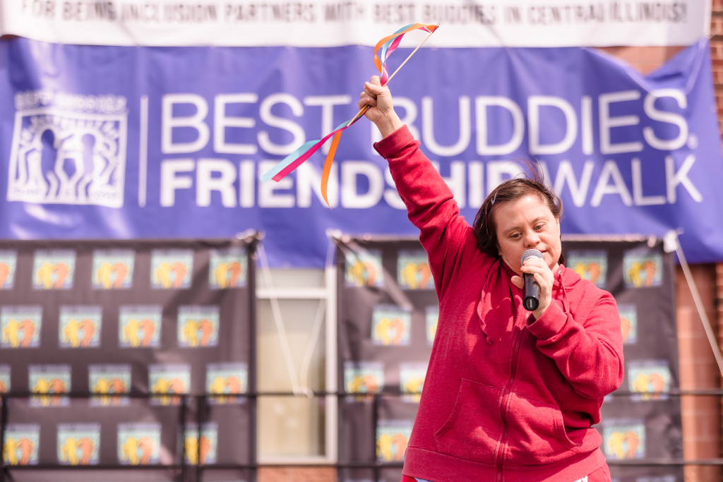 Best Buddies participant sings karaoke at the Friendship Walk!